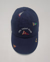 Navy blue linen Polo Ralph Lauren adjustable hat with embroidered nautical flag and leather strap back.